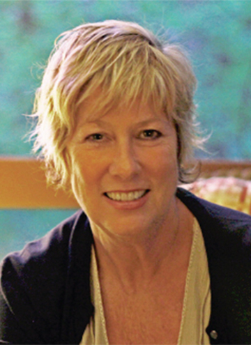 Photo of Marcia Aldrich. Portrait of middle aged woman with short blonde hair.